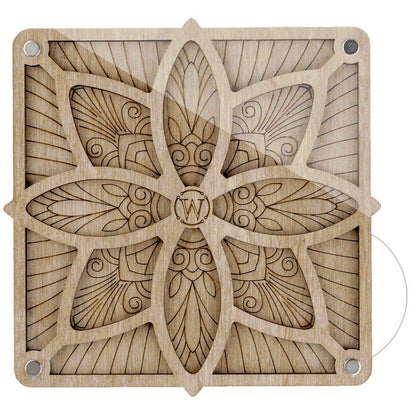 a wooden block with a flower design on it