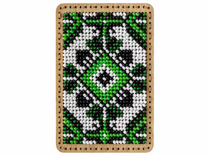 a cross stitch picture of a green and white flower