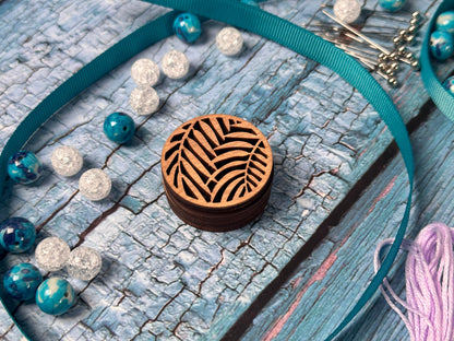 a necklace with a wooden box on it