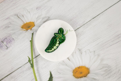 a pea pea pod sitting on top of a white plate