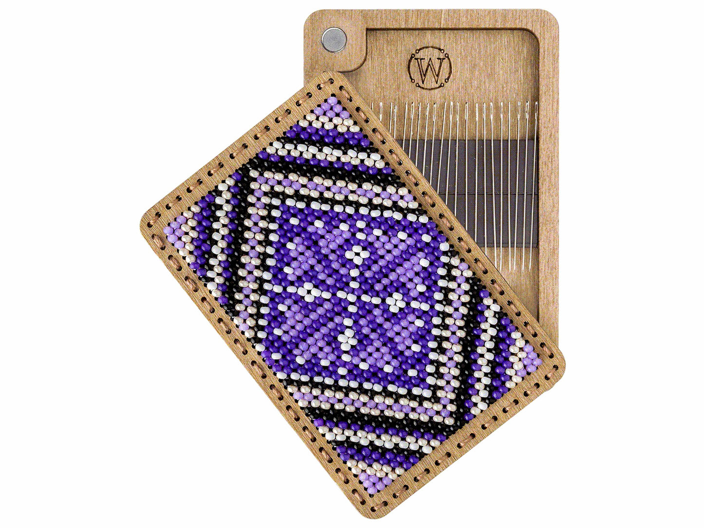 a piece of wood with a beaded pattern on it