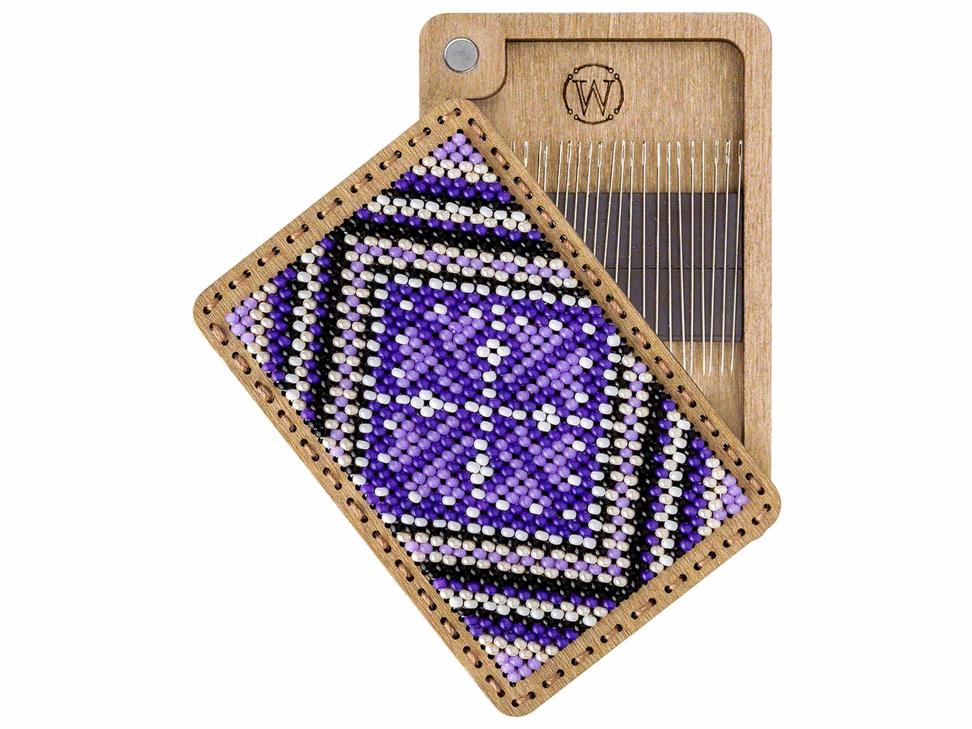 a piece of wood with a beaded pattern on it
