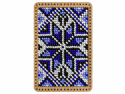 a beaded picture of a cross on a white background