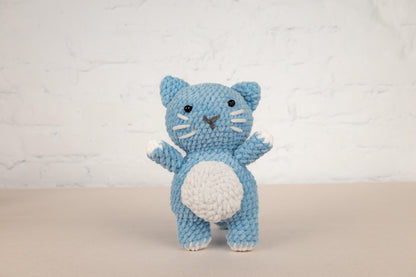 a crocheted blue and white kitty cat