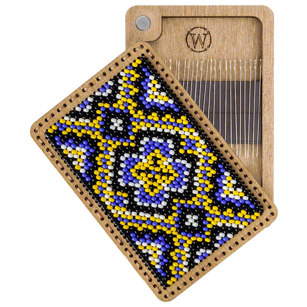 a wooden weaving loom with a beaded design on it