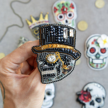 a person holding a brooch in their hand