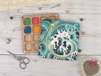 a craft kit with a wooden box and scissors on a white table