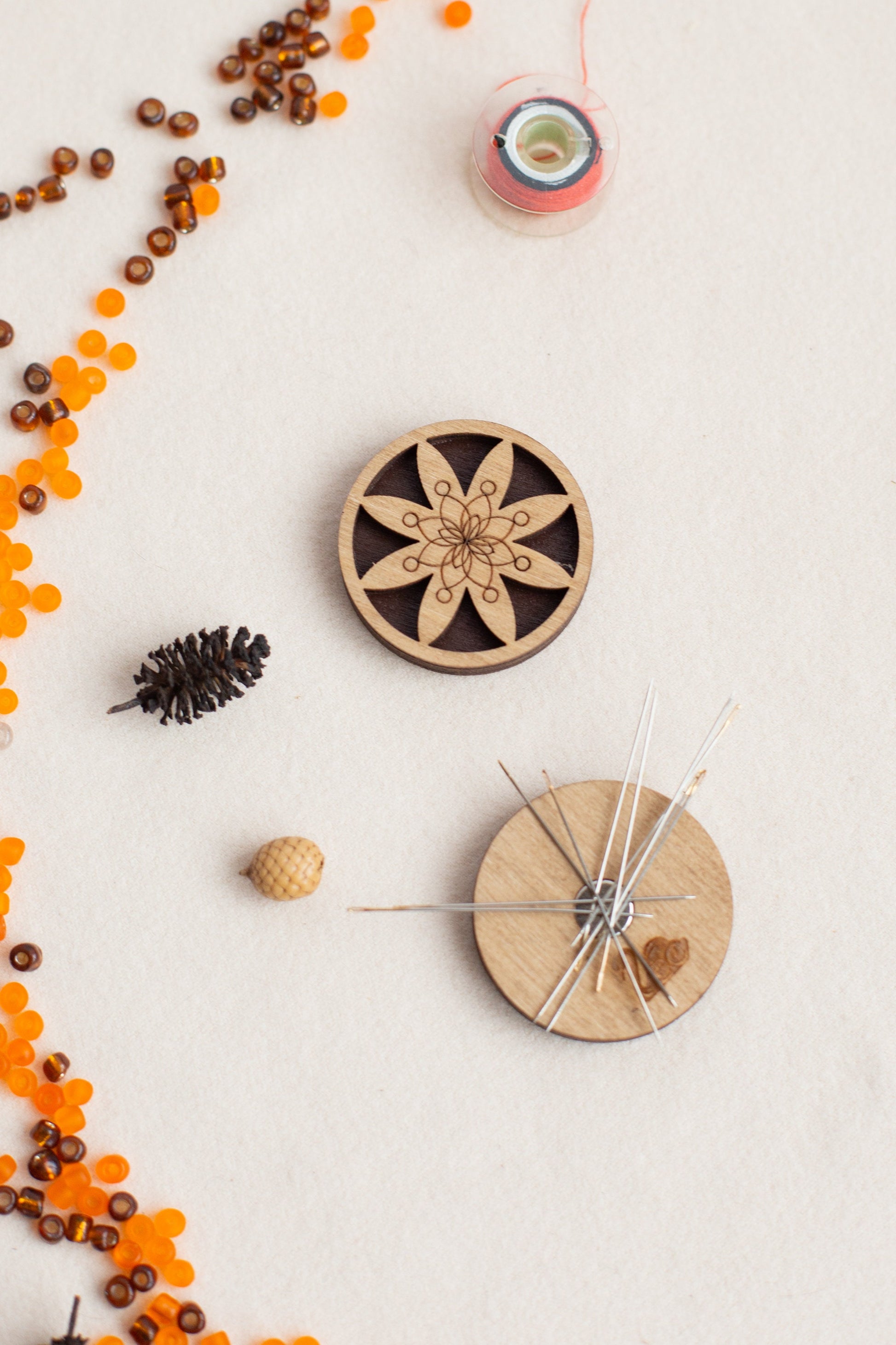a wooden clock surrounded by beads and other items