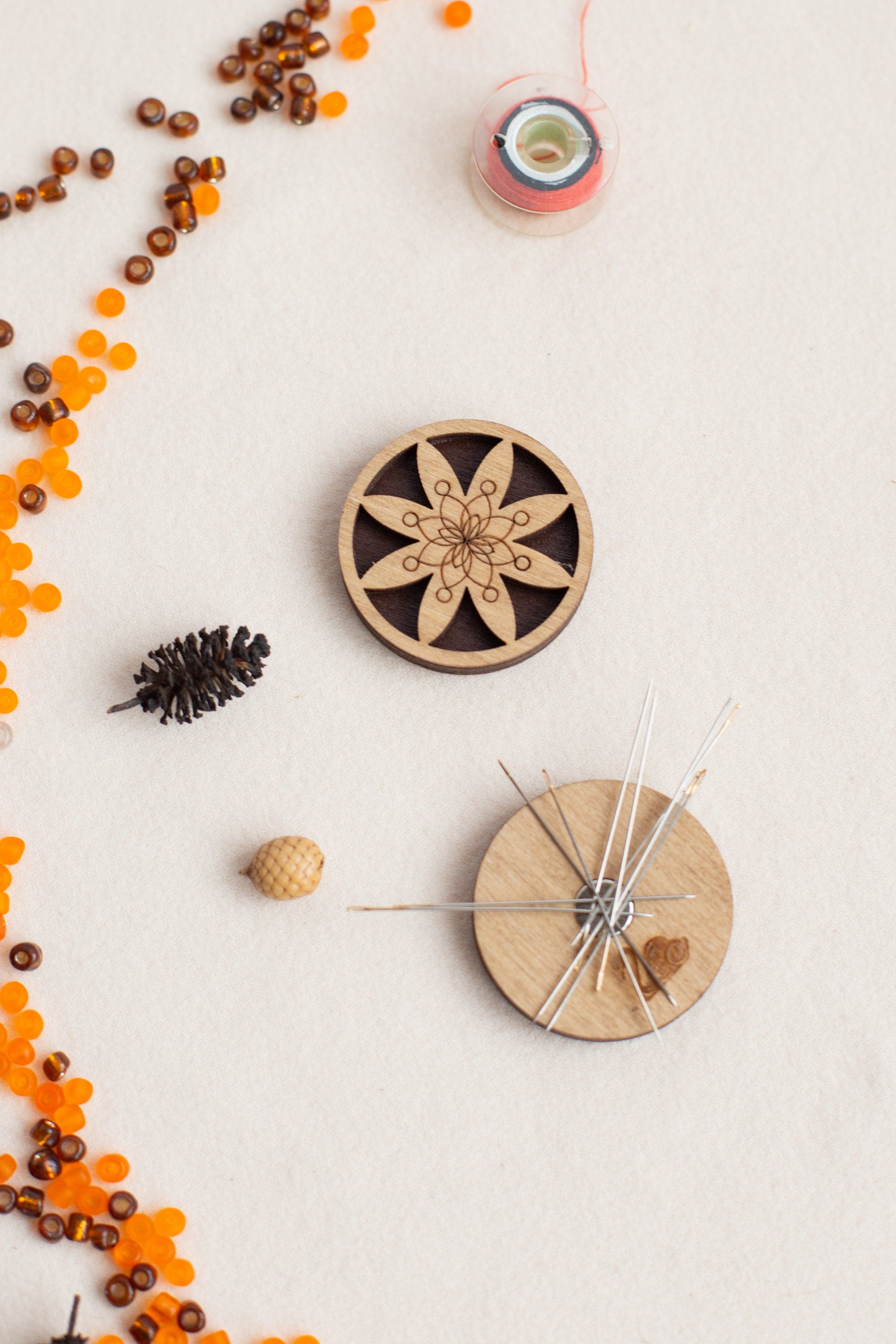 a wooden clock surrounded by beads and other items