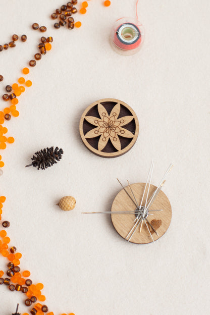 a wooden clock surrounded by beads and other items