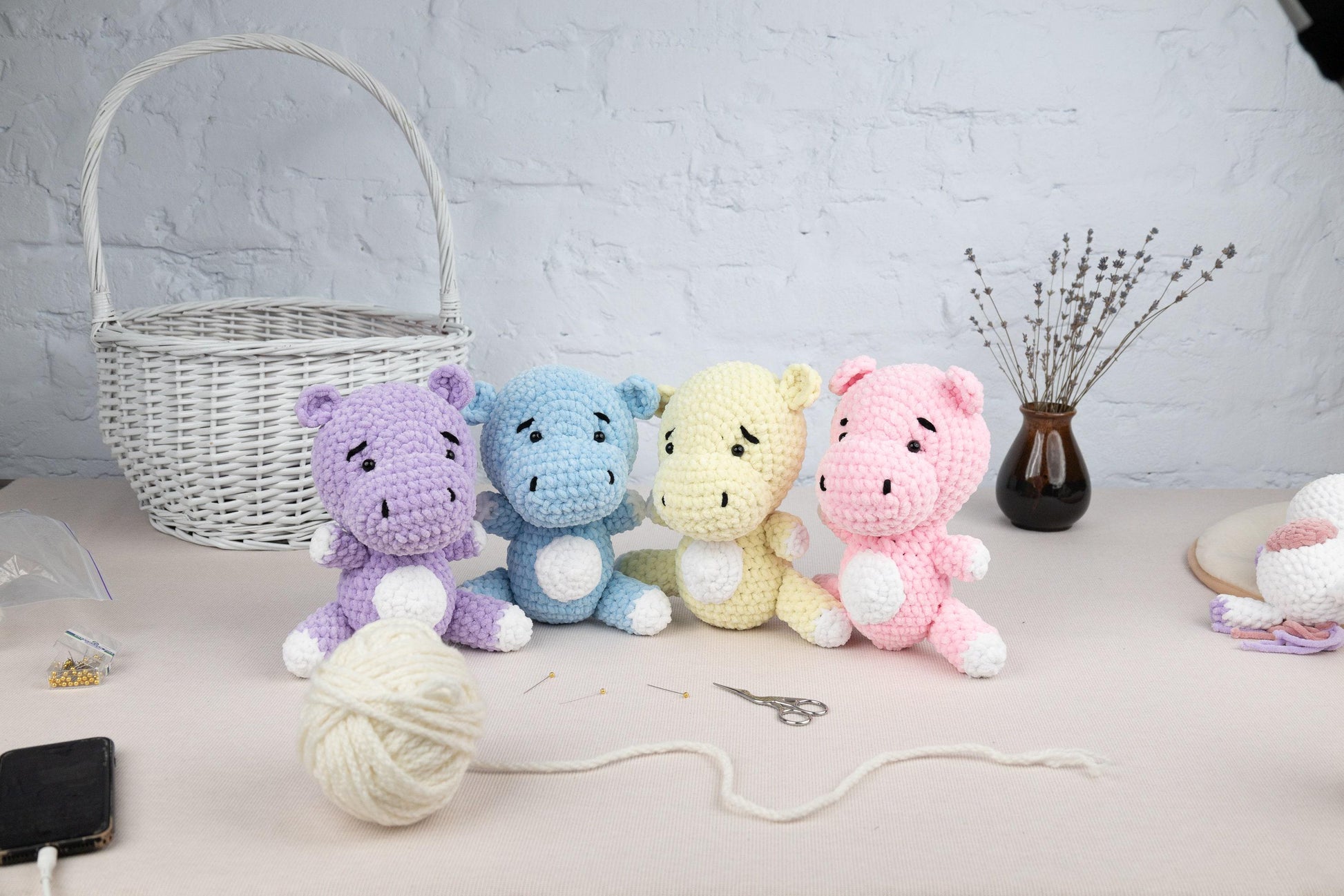 a group of crocheted stuffed animals sitting on a table