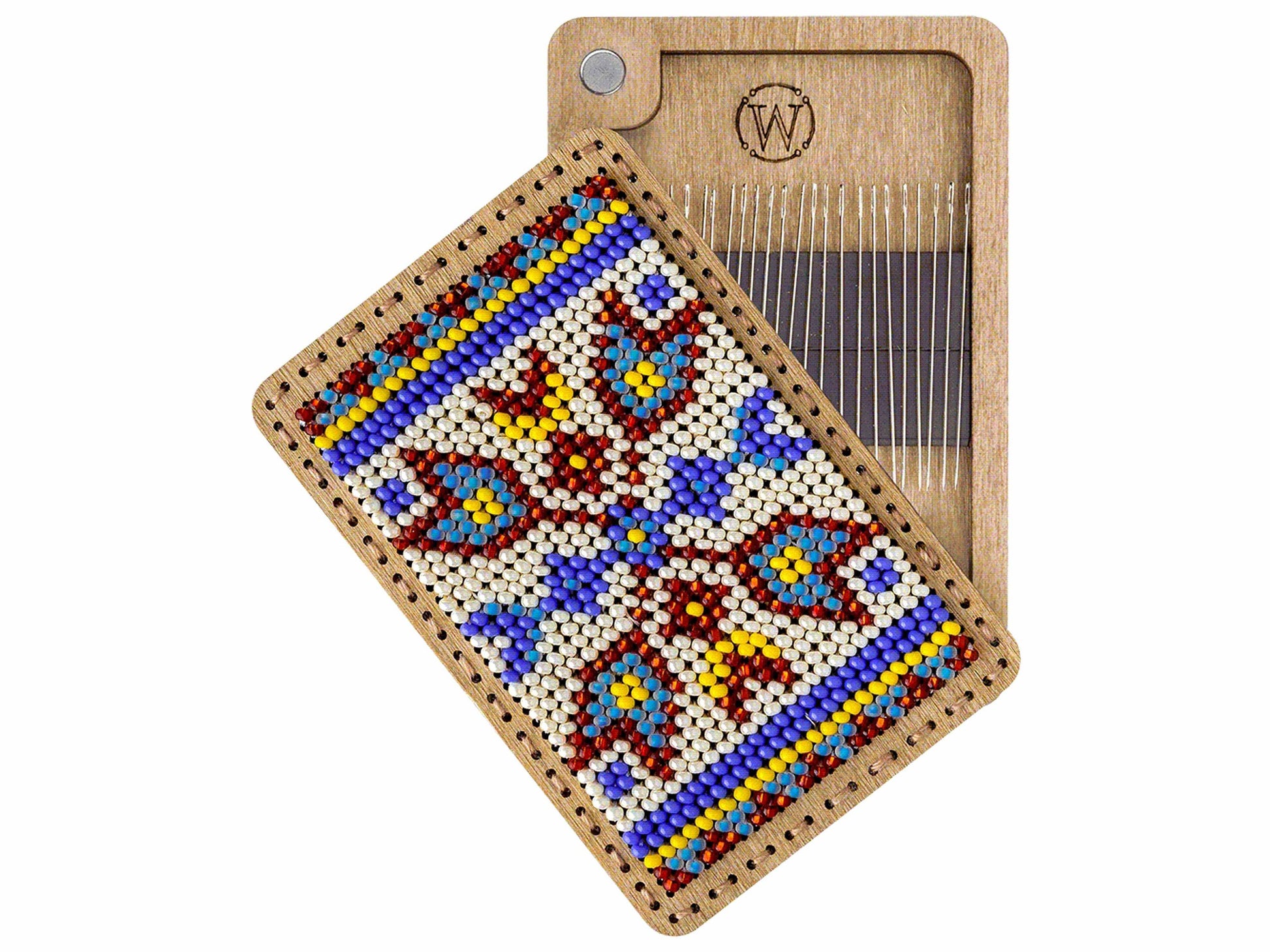 a wooden comb with a beaded design on it