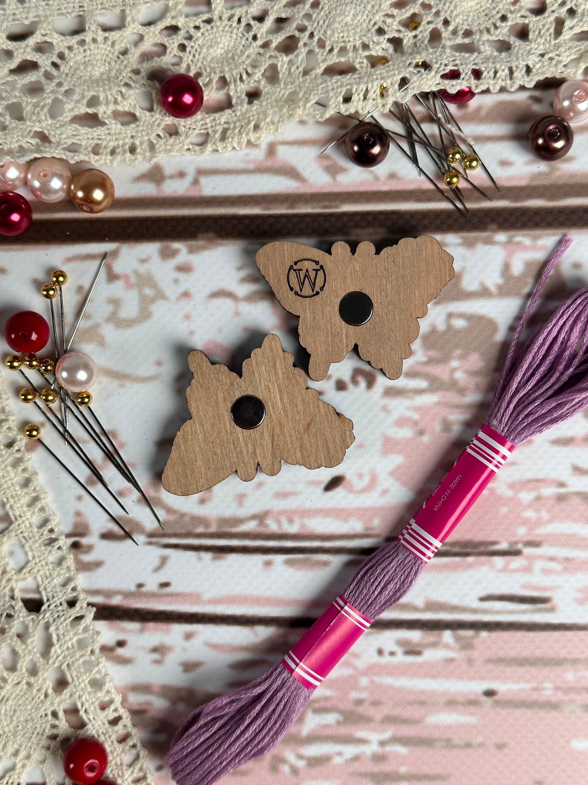 a piece of wood with a tassel on top of it