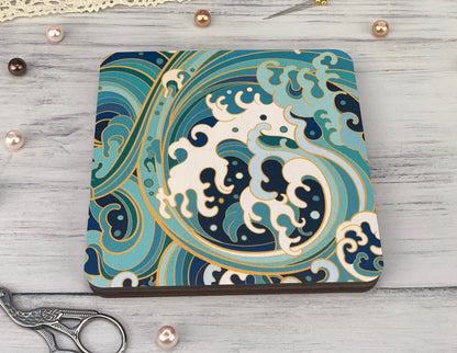 a blue and white coaster with a design on it