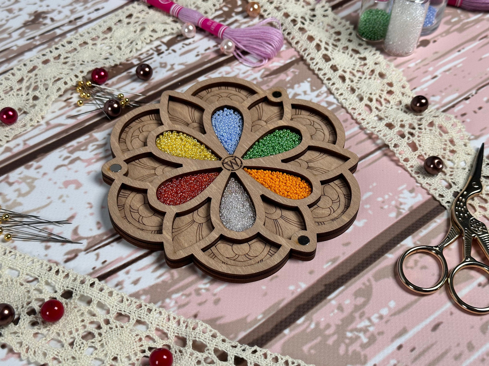 a table topped with a wooden cut out of a flower