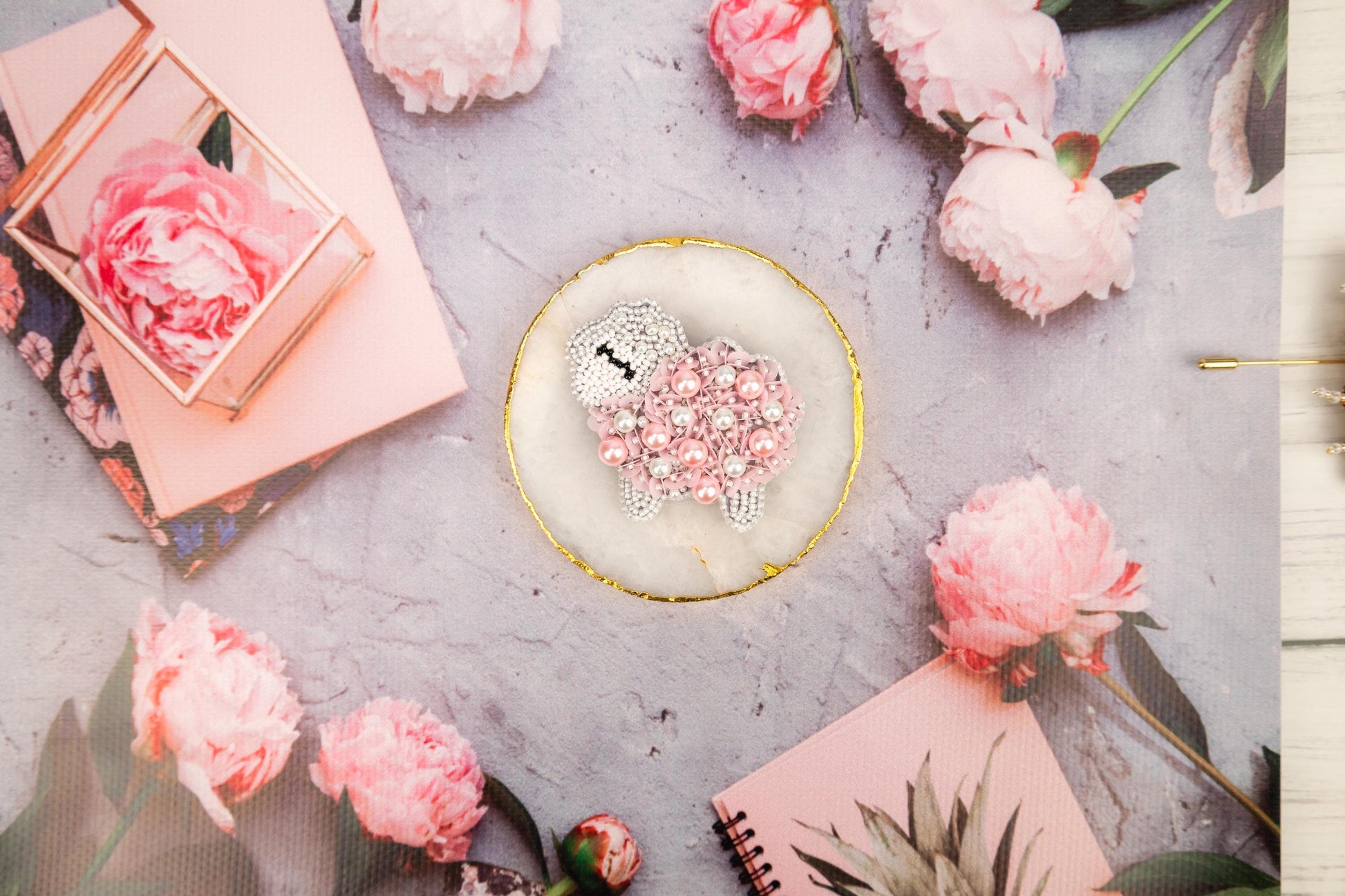 a table topped with pink flowers and a cake