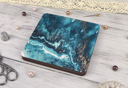 a blue marble coaster sitting on top of a white table