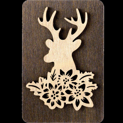 a wooden cutout of a deer with flowers