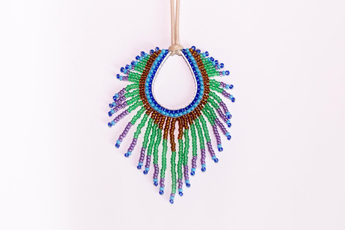 a colorful beaded necklace hanging from a string