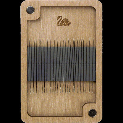 a close up of a piece of wood with needles