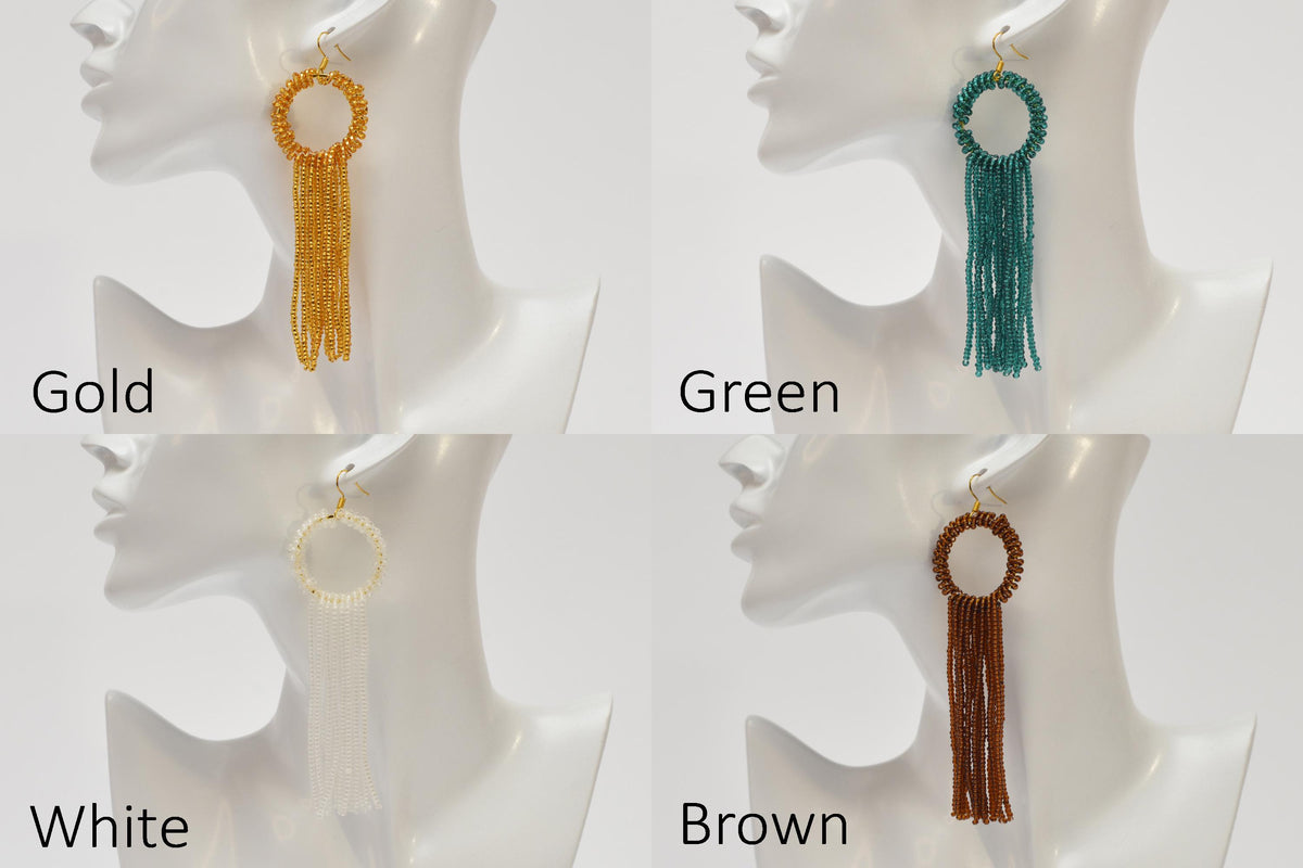 The image is a collage of four images showing different styles of earrings with tassels, each in a different color: gold, green, white, and brown.