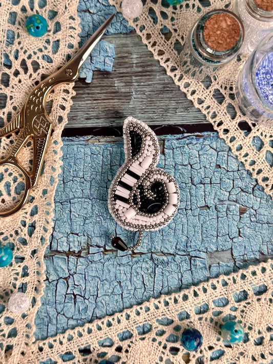 a pair of scissors sitting on top of a doily