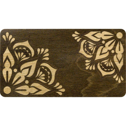 a wooden cutting board with a floral design on it