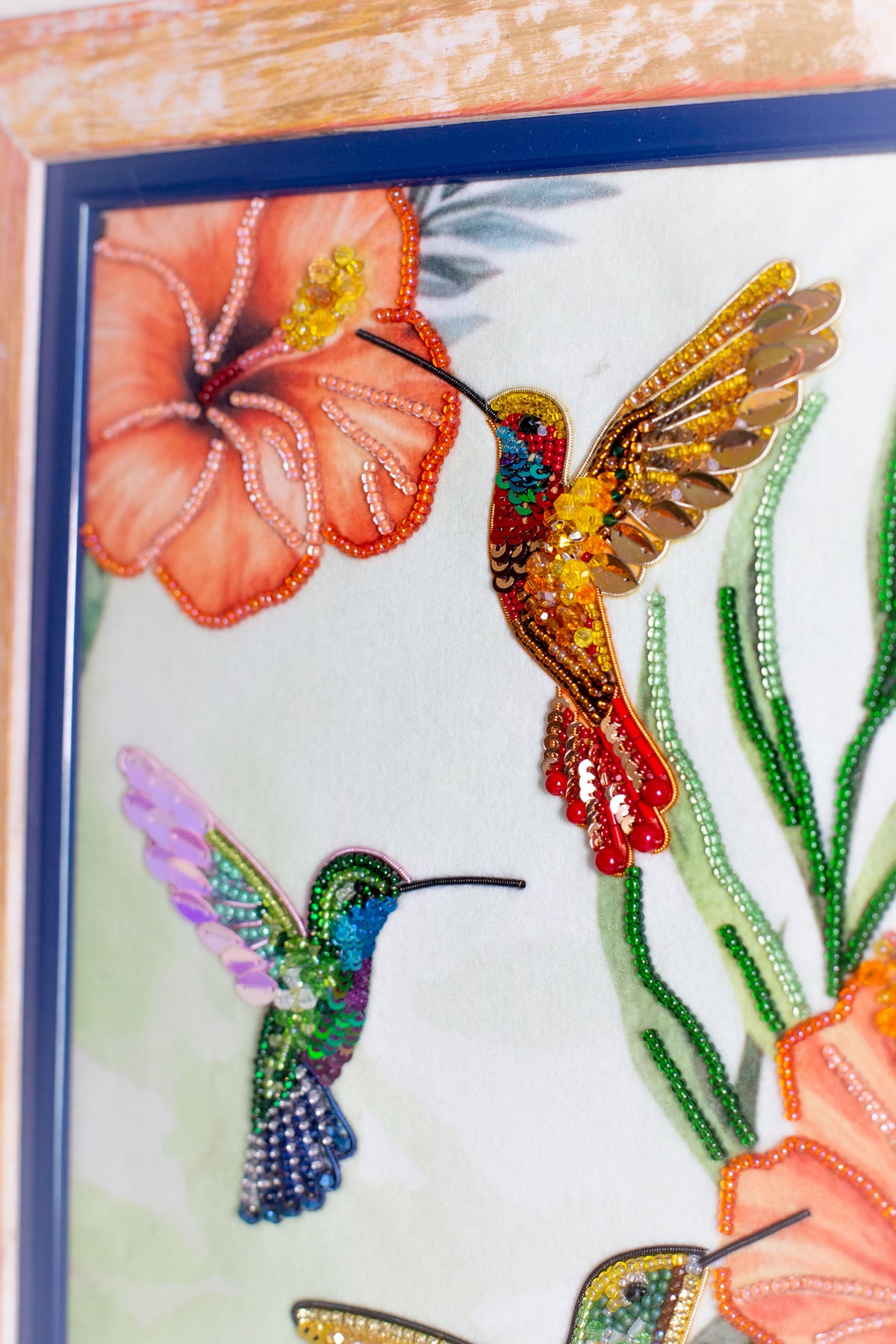 a picture of a picture of a hummingbird and flowers
