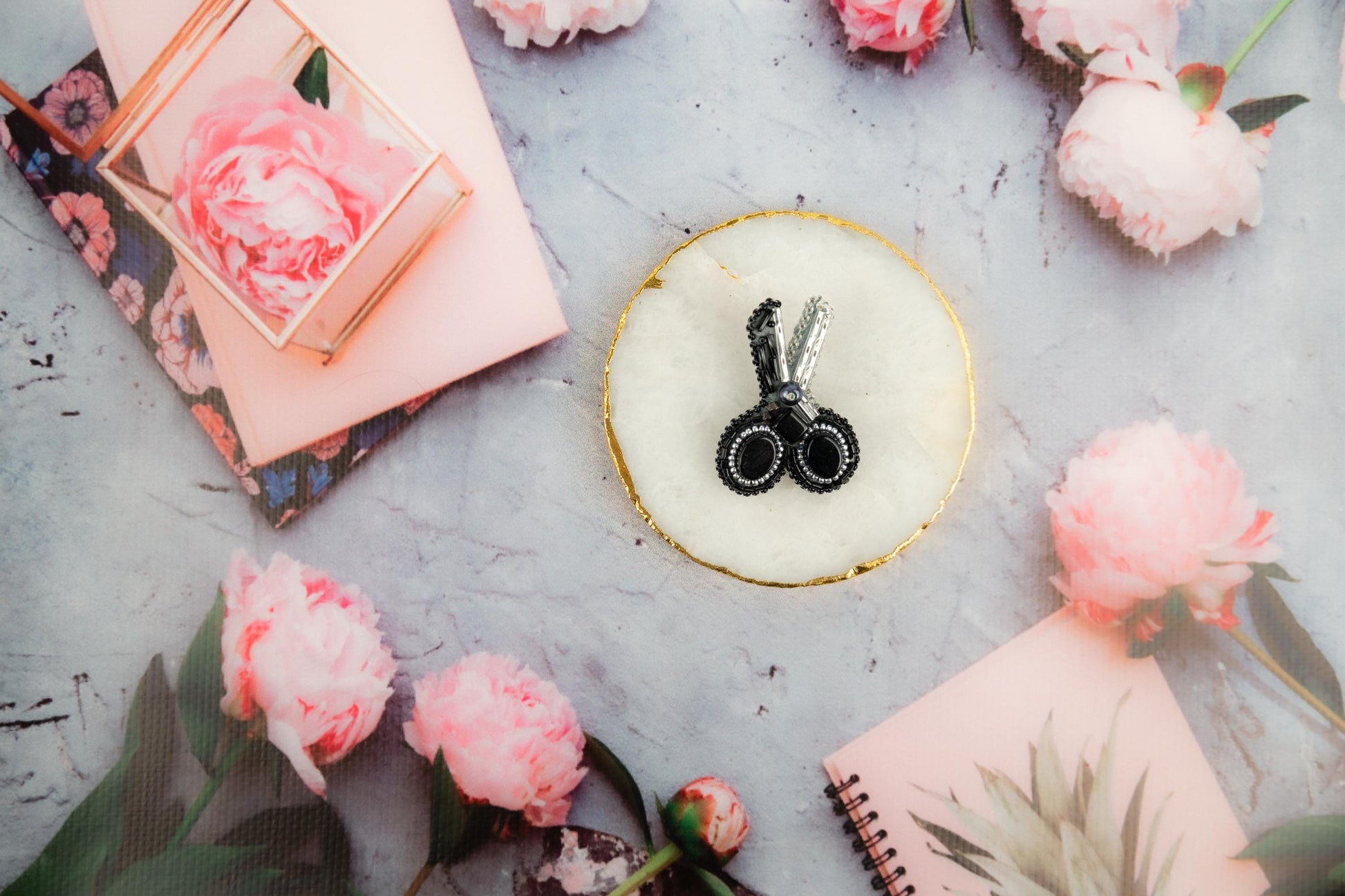 a cake with a pair of scissors on top of it
