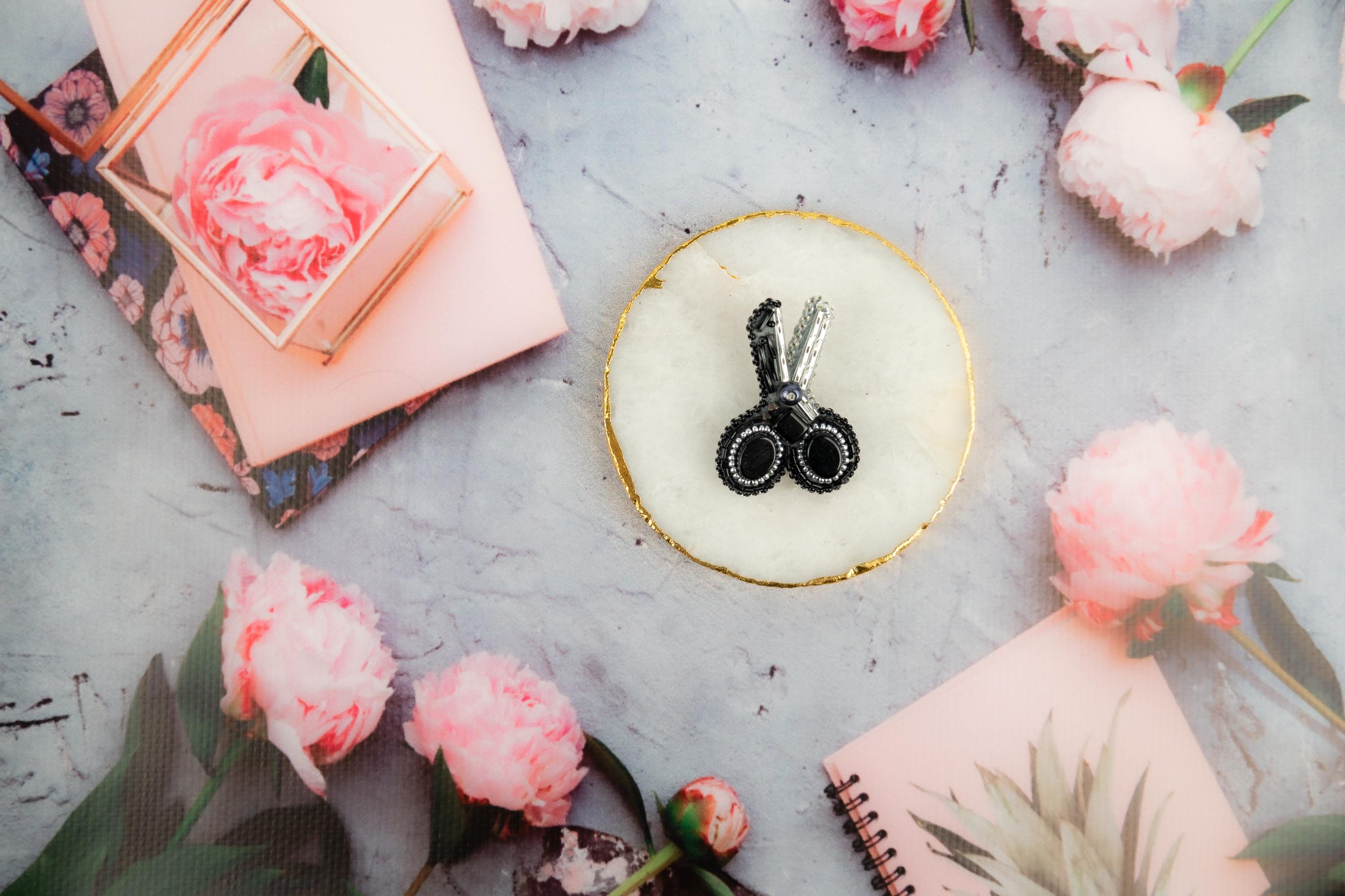 a cake with a pair of scissors on top of it