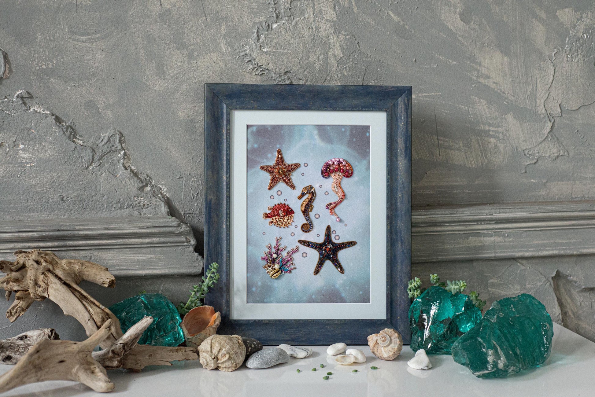 a picture of sea shells and starfish on a table