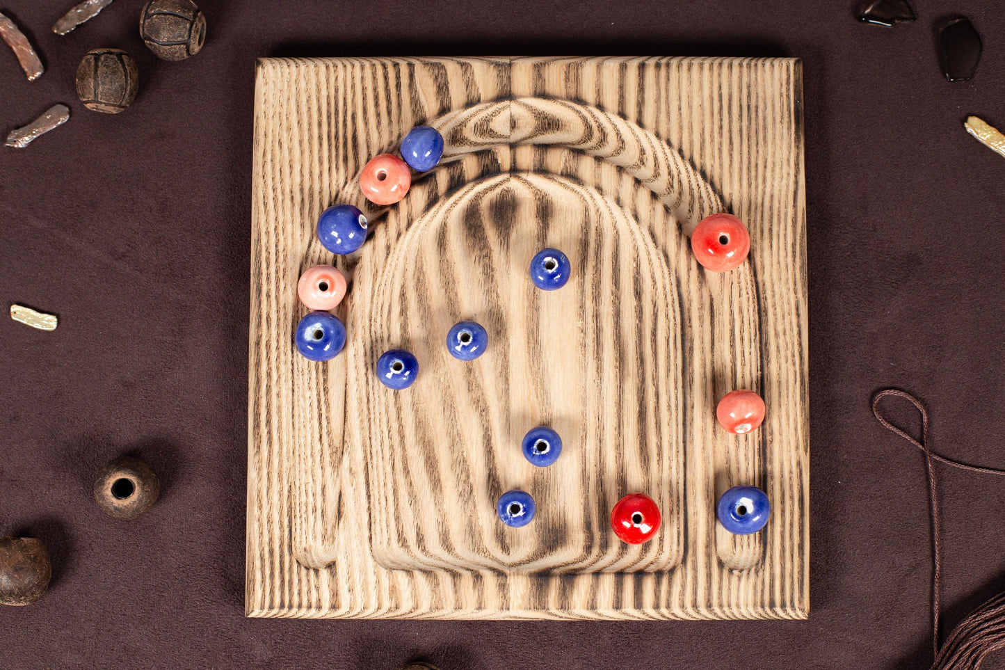 a picture of a wooden board with buttons on it