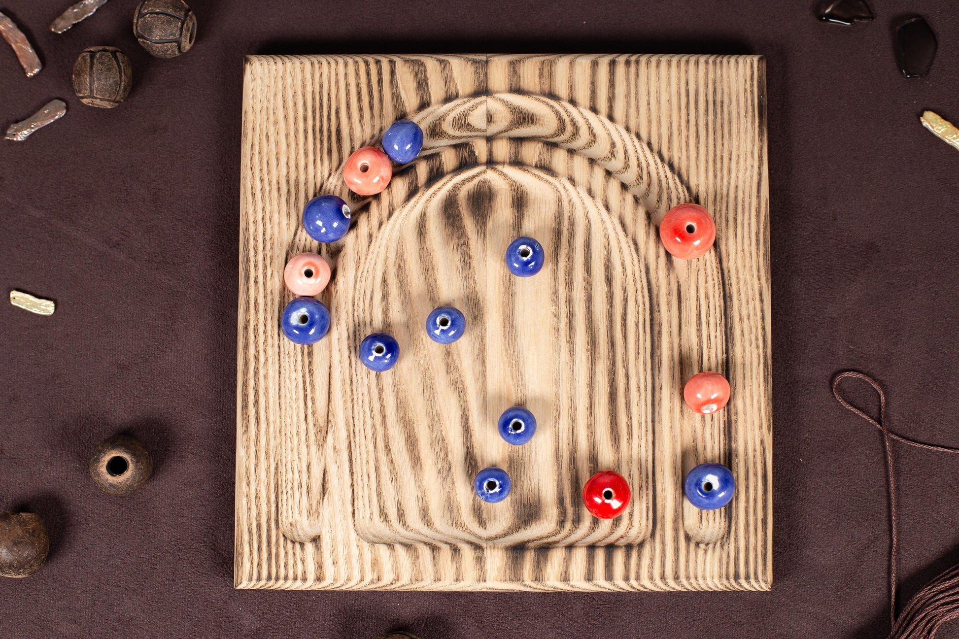 a picture of a wooden board with buttons on it