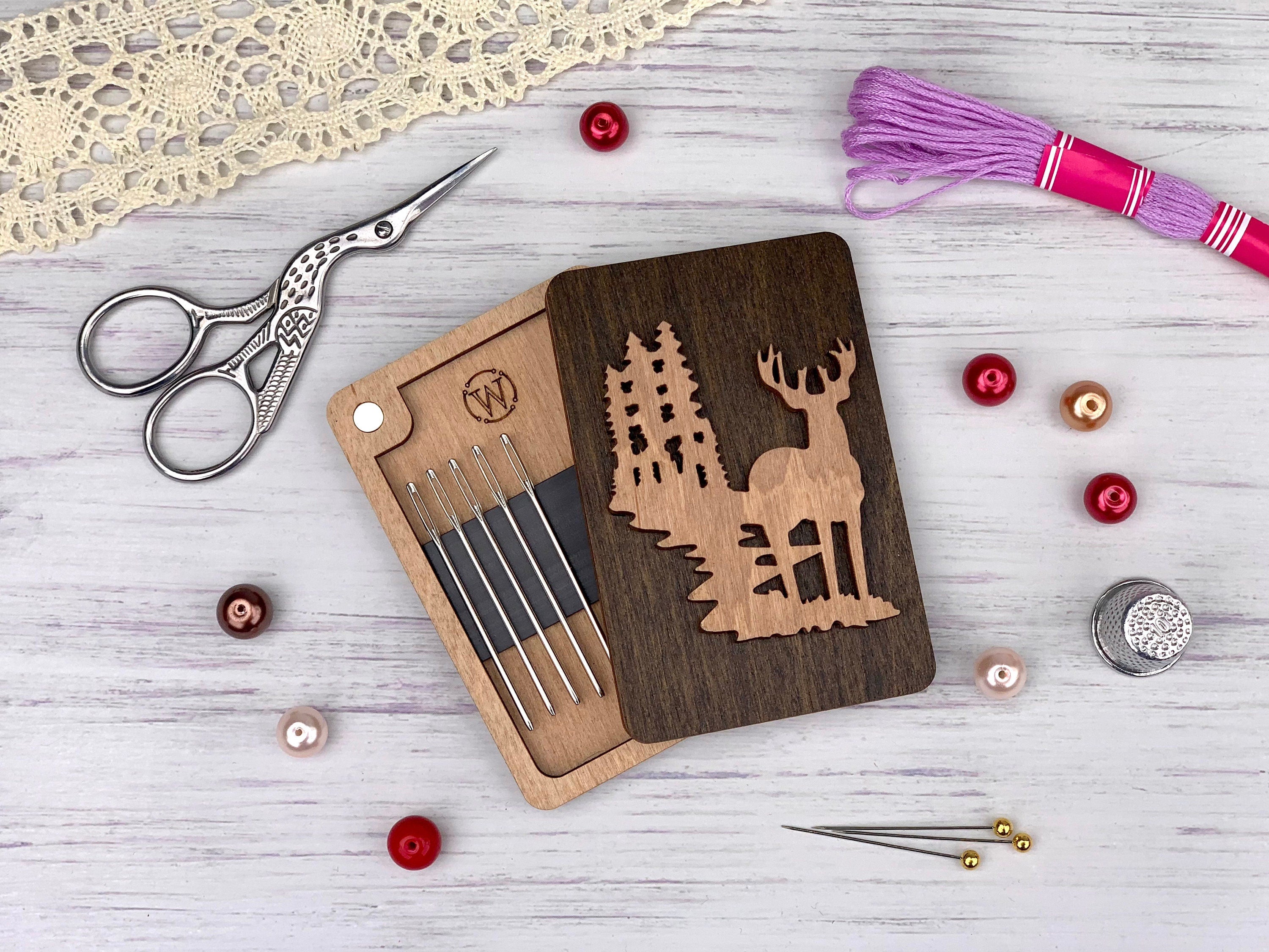 a wooden cutting board with a deer and trees cut out of it