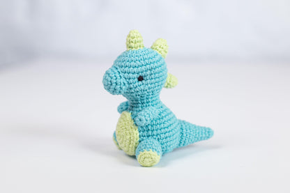 a crocheted blue and yellow stuffed animal