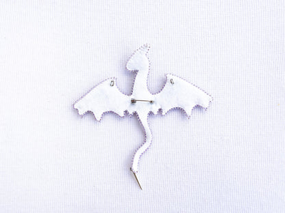 a white piece of fabric with a bat on it