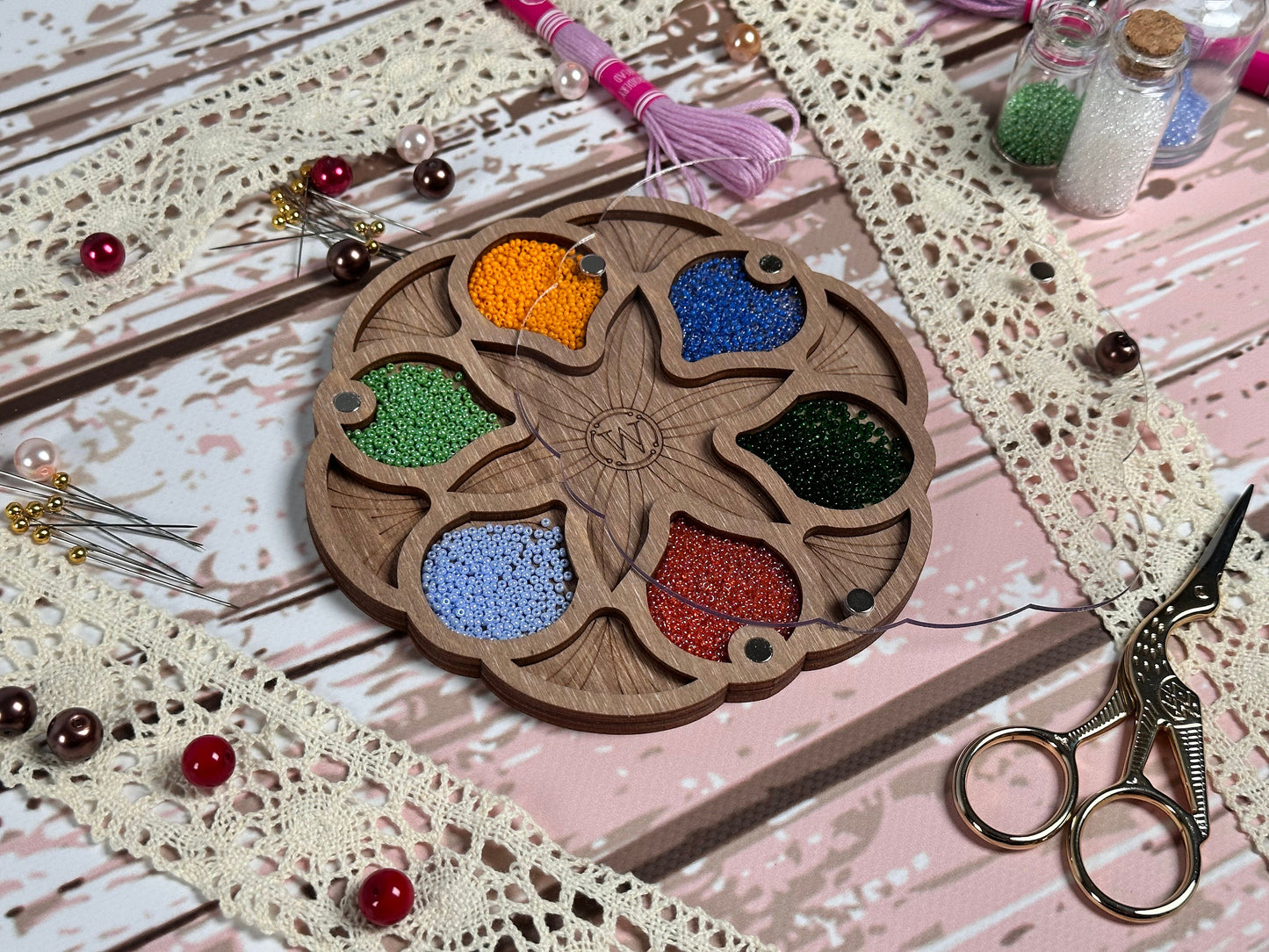 a wooden plate with a bunch of beads on it