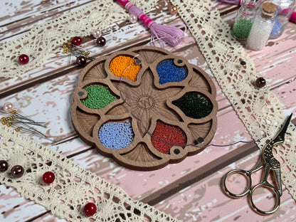 a wooden plate with a bunch of beads on it
