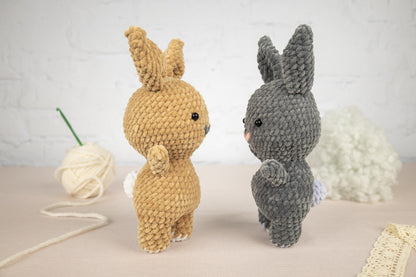 a couple of stuffed animals sitting on top of a table