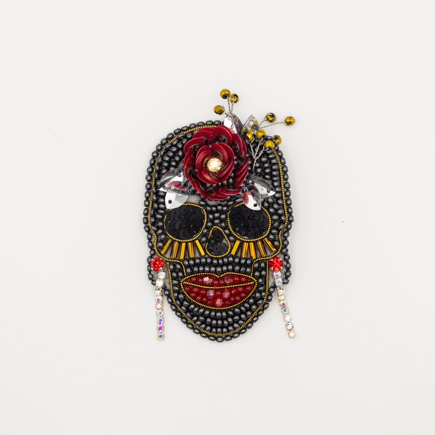 a black and red mask with a flower on it