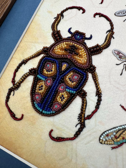 a picture of a bug made out of beads