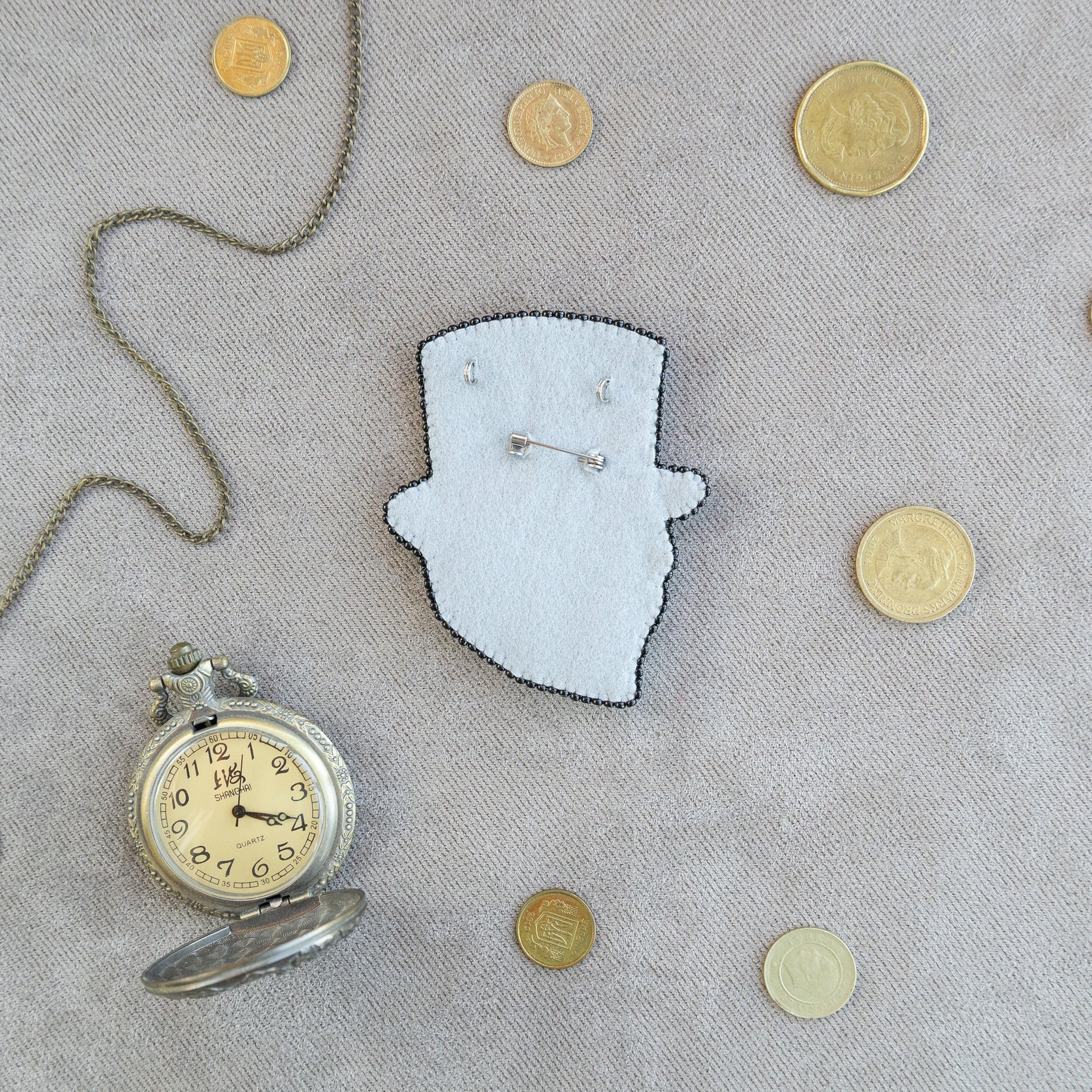 a clock and some coins on a table