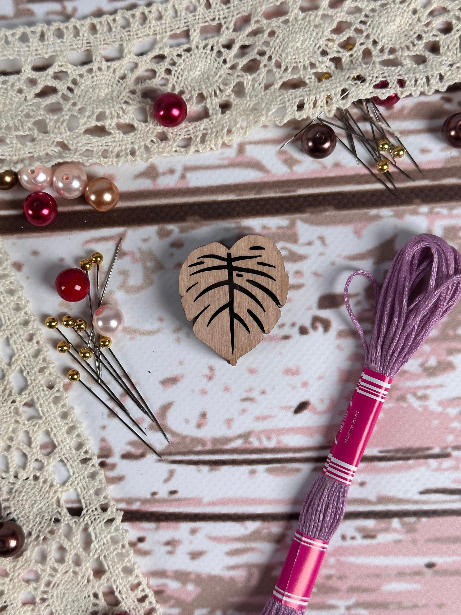 a close up of a piece of wood with beads