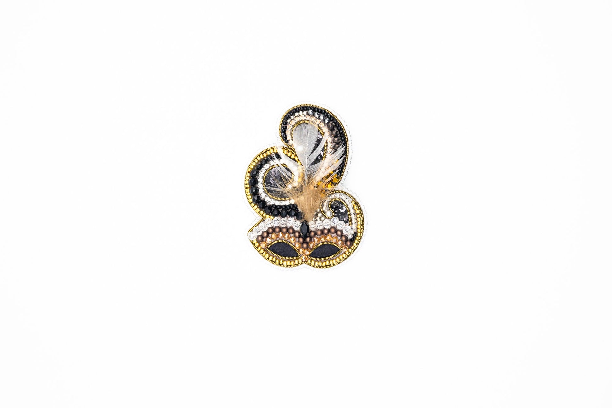 a close up of a snowman shaped object on a white surface