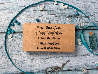 a wooden business card sitting on top of a table