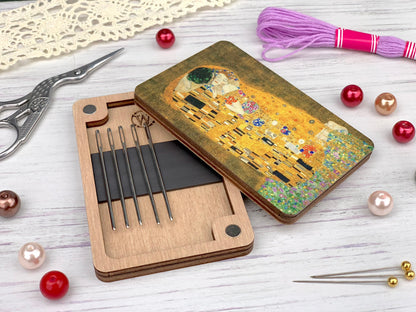 a box with a picture of a couple on it next to a pair of knitting