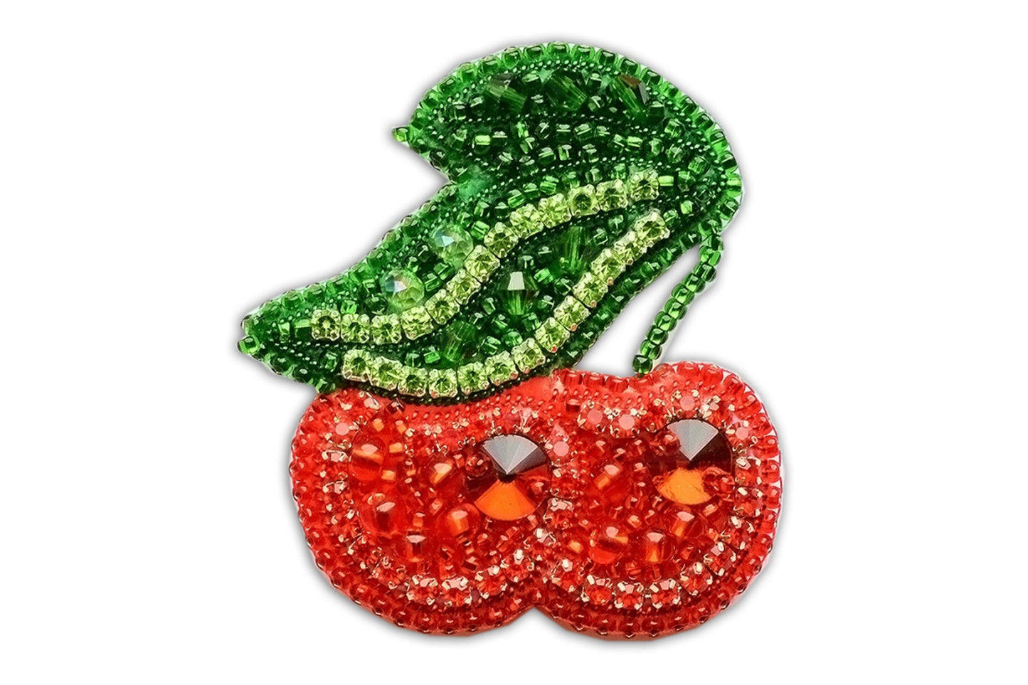 a pair of red tomatoes with green leaves