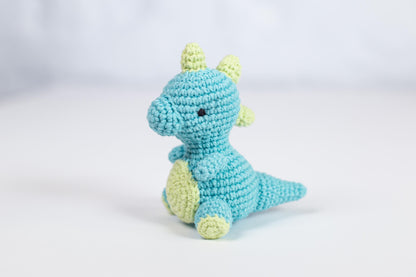 a crocheted blue and yellow stuffed animal