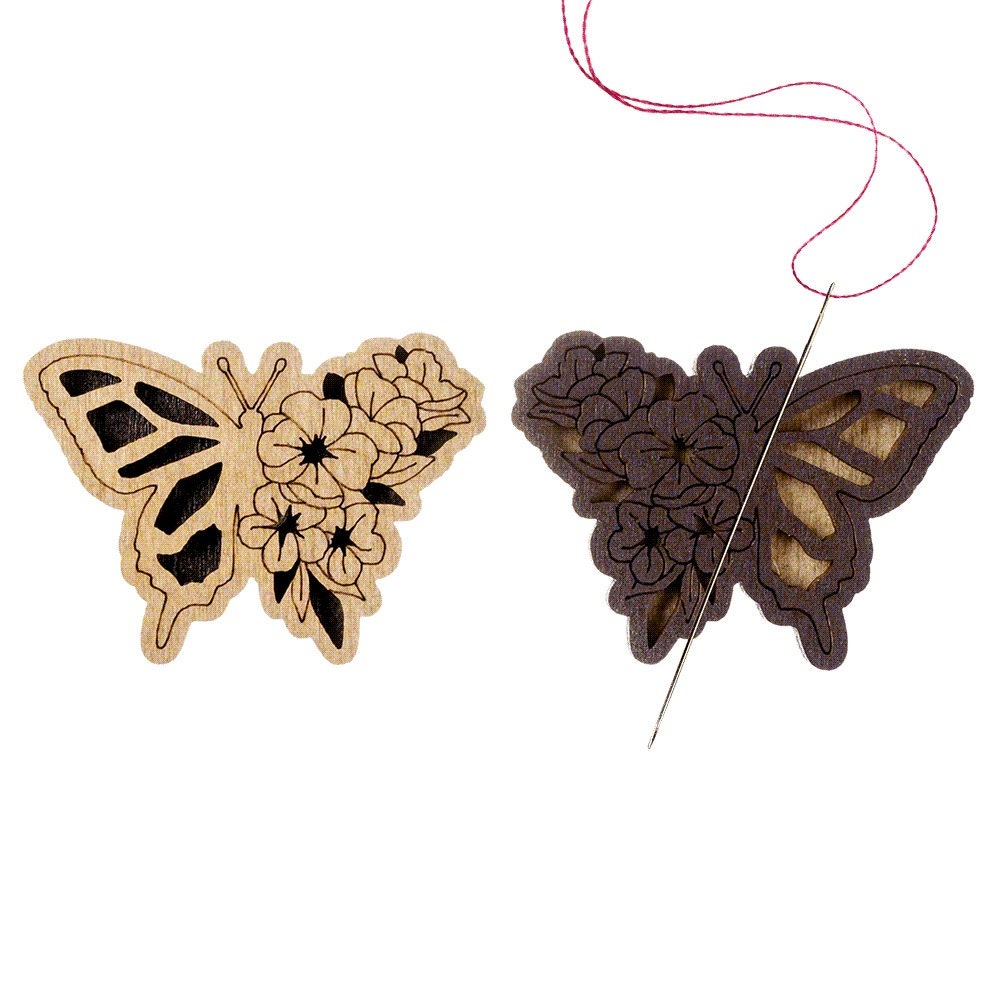 a butterfly and a butterfly shaped object on a white background