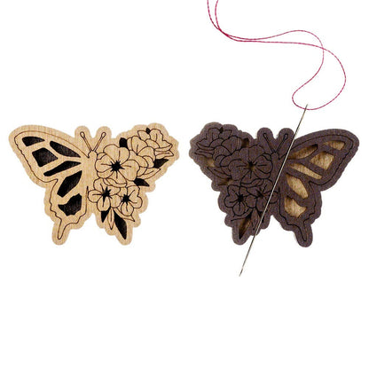 a butterfly and a butterfly shaped object on a white background